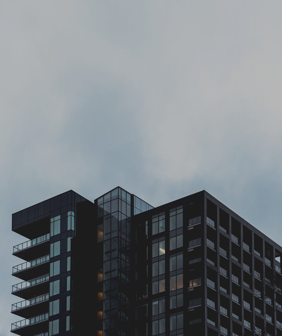 Modern multistage house exterior under cloudy sky in city